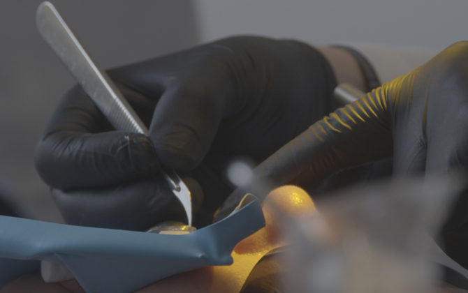 Dr. Nejad performing a Biomimetic Dental procedure with rubber dam